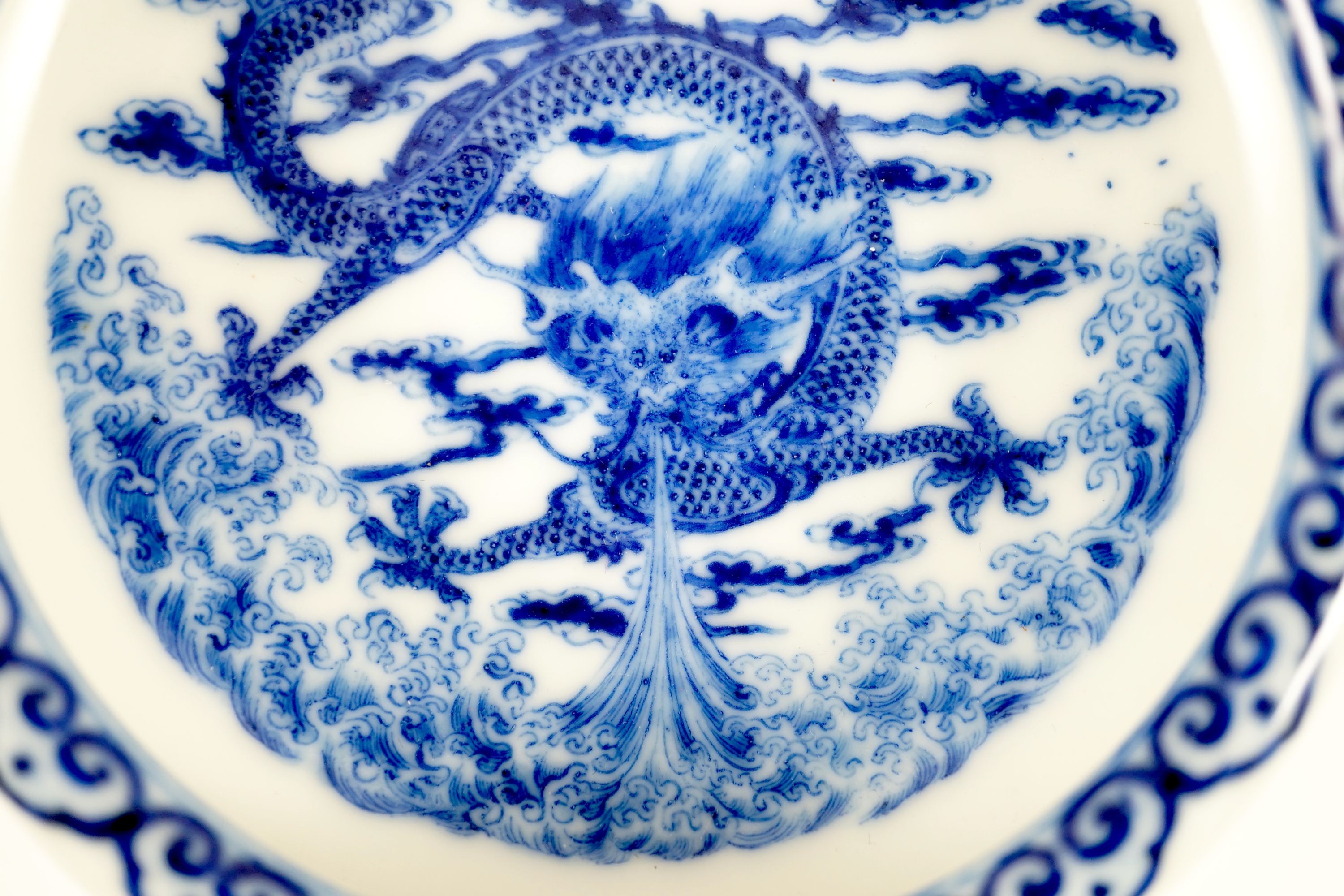A Chinese blue and white 'dragon' brushwasher, Qianlong seal mark but Republic period, 13 cm diameter, wood stand and case
